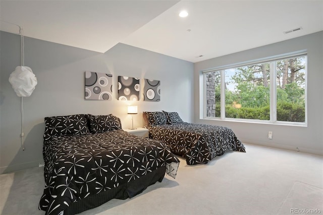 bedroom with carpet, visible vents, and baseboards