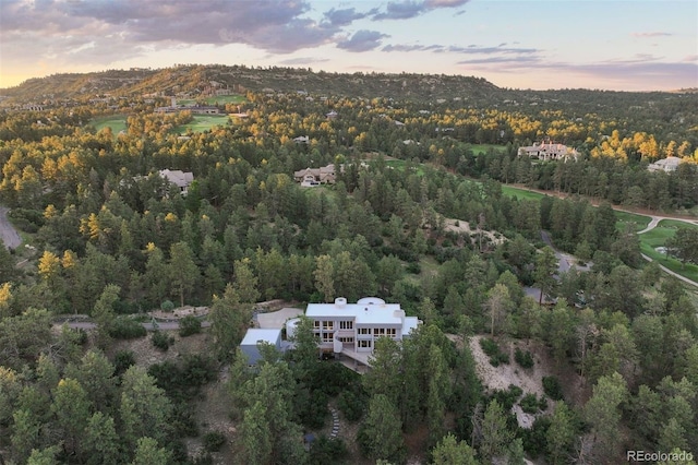 bird's eye view featuring a forest view