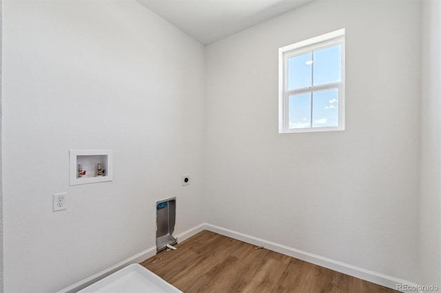laundry room featuring wood finished floors, laundry area, electric dryer hookup, washer hookup, and baseboards