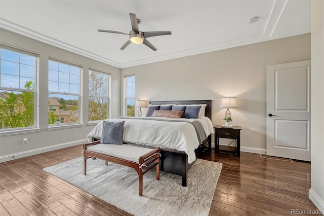 10365 Prairie Sky Pl, Lone Tree, CO 80124 - bedroom with multiple windows, hardwood / wood-style flooring, ceiling fan, and crown molding