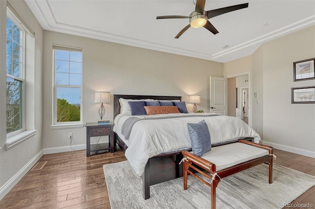 10365 Prairie Sky Pl, Lone Tree, CO 80124 - bedroom with wood finished floors, multiple windows, and ceiling fan