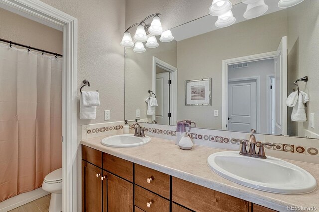 10365 Prairie Sky Pl, Lone Tree, CO 80124 - bathroom with toilet and double vanity