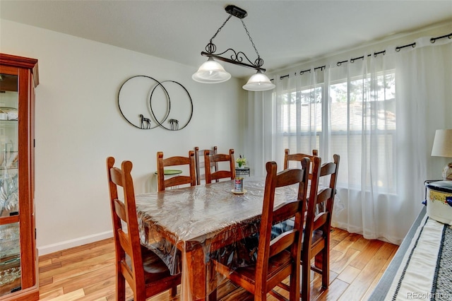 8555 Angela Ln, Parker, CO 80134 - dining room featuring light wood-style flooring and baseboards