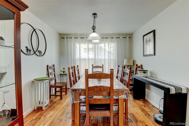 8555 Angela Ln, Parker, CO 80134 - dining space featuring light wood-style flooring and baseboards