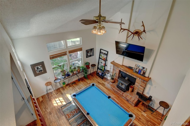 8555 Angela Ln, Parker, CO 80134 - game room with high vaulted ceiling, wood finished floors, a textured ceiling, billiards table, and baseboards