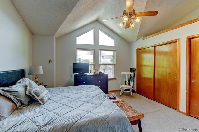 8555 Angela Ln, Parker, CO 80134 - bedroom featuring lofted ceiling, carpet floors, a ceiling fan, baseboards, and two closets