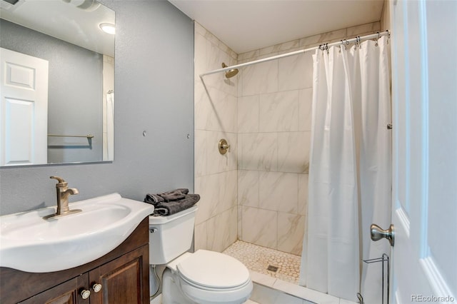 8555 Angela Ln, Parker, CO 80134 - bathroom with a tile shower, toilet, and vanity
