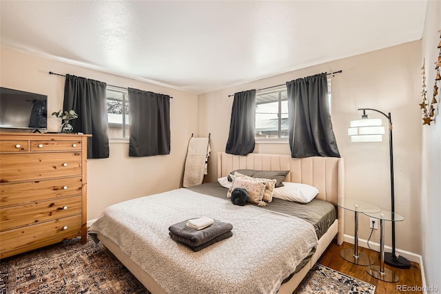 bedroom featuring dark wood-type flooring