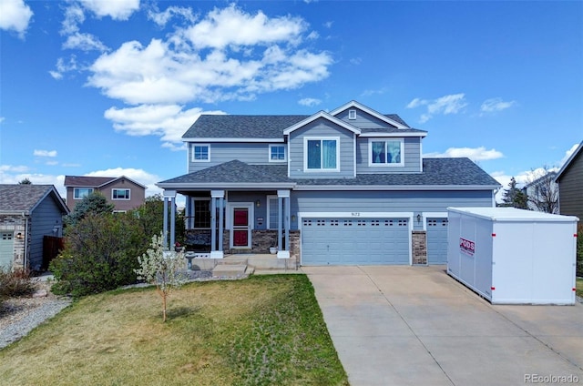 9172 Sunningdale Rd, Peyton, CO 80831 - view of front facade featuring a garage, driveway, roof with shingles, and a front yard