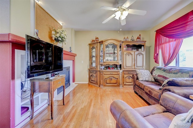 9172 Sunningdale Rd, Peyton, CO 80831 - living area featuring ceiling fan, light wood-style flooring, and a tile fireplace