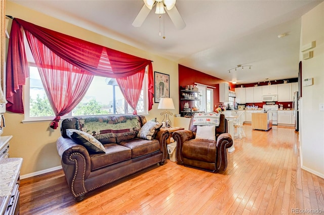 9172 Sunningdale Rd, Peyton, CO 80831 - living room with a ceiling fan, plenty of natural light, and light wood-style flooring
