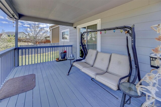 9172 Sunningdale Rd, Peyton, CO 80831 - wooden terrace with a lawn and fence