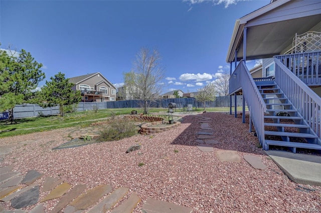 9172 Sunningdale Rd, Peyton, CO 80831 - view of yard featuring a deck, stairs, and a fenced backyard