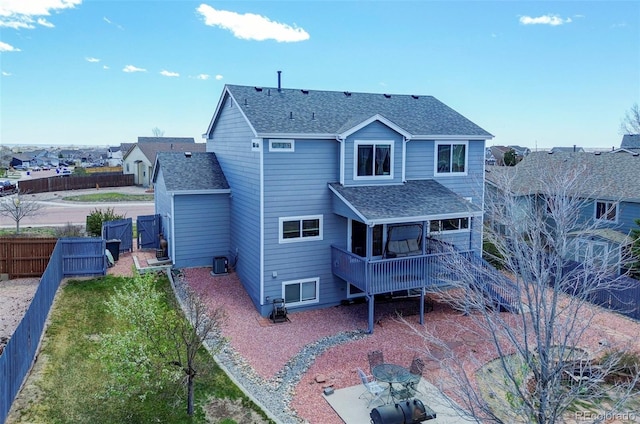 9172 Sunningdale Rd, Peyton, CO 80831 - rear view of property featuring a fenced backyard, roof with shingles, a deck, and central AC unit