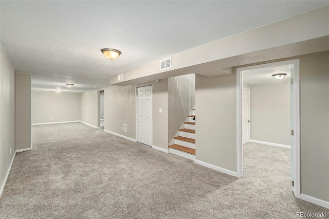 3092 S Kearney St, Denver, CO 80222 - finished basement with carpet floors, stairs, baseboards, and a textured ceiling