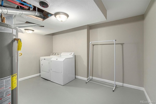 washroom with gas water heater and independent washer and dryer