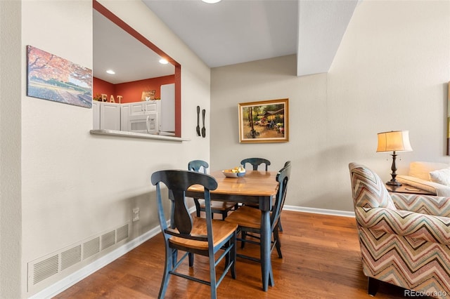 dining room with hardwood / wood-style floors