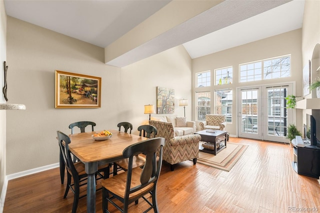 dining space with hardwood / wood-style floors