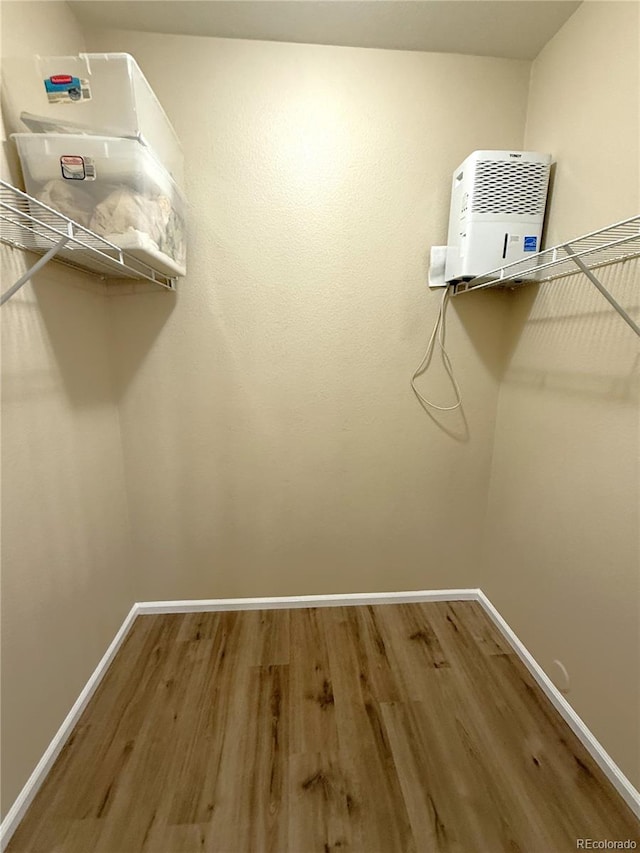 4451 S Ammons St Unit 108, Littleton, CO 80123 - walk in closet with wood finished floors