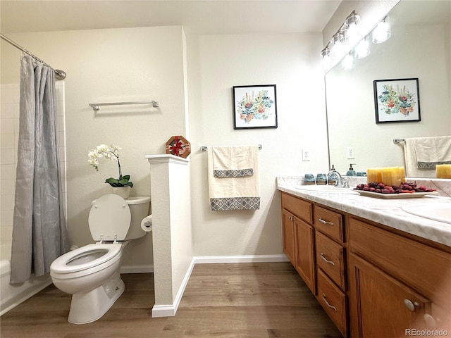 4451 S Ammons St Unit 108, Littleton, CO 80123 - full bath with wood finished floors, vanity, and shower / tub combo with curtain