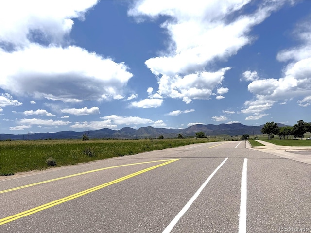 4451 S Ammons St Unit 108, Littleton, CO 80123 - view of asphalt road featuring a mountain view