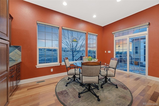 dining space featuring recessed lighting, baseboards, visible vents, and light wood finished floors