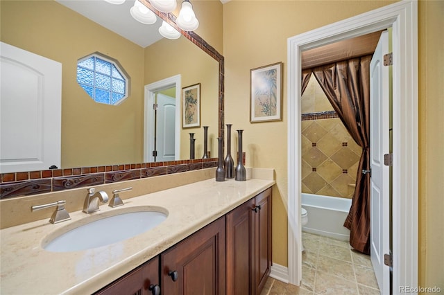 bathroom with toilet, vanity, and shower / bathtub combination with curtain