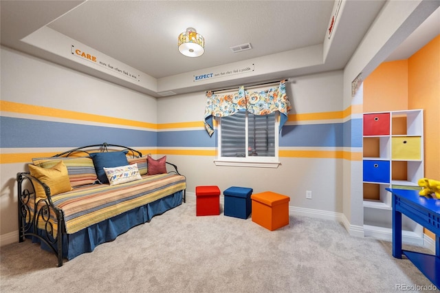 bedroom featuring visible vents, baseboards, and carpet