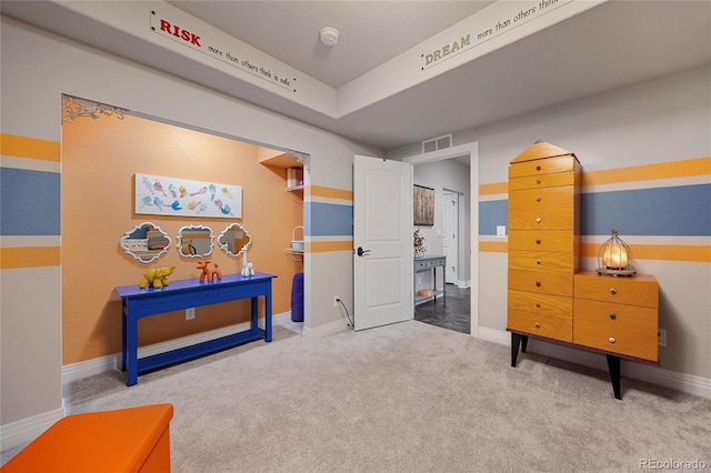 rec room featuring visible vents, baseboards, and carpet flooring