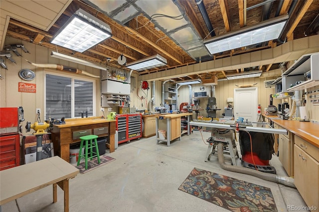 misc room featuring a workshop area and concrete flooring