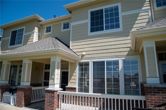 16180 E Geddes Ln Unit 14, Aurora, CO 80016 - entrance to property featuring a shingled roof and covered porch