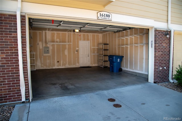 16180 E Geddes Ln Unit 14, Aurora, CO 80016 - garage featuring electric panel and concrete driveway