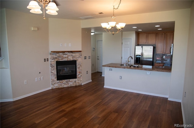 16180 E Geddes Ln Unit 14, Aurora, CO 80016 - kitchen featuring stainless steel fridge, a chandelier, dark wood finished floors, a peninsula, and recessed lighting