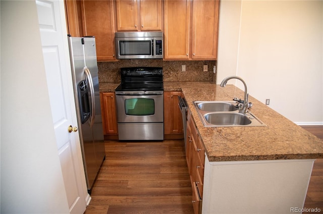 16180 E Geddes Ln Unit 14, Aurora, CO 80016 - kitchen with stainless steel appliances, a peninsula, and dark wood finished floors
