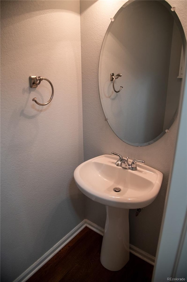 16180 E Geddes Ln Unit 14, Aurora, CO 80016 - bathroom featuring wood finished floors and baseboards