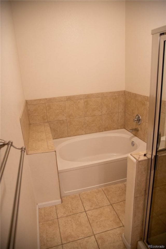16180 E Geddes Ln Unit 14, Aurora, CO 80016 - bathroom featuring a garden tub, tile patterned floors, and a shower stall