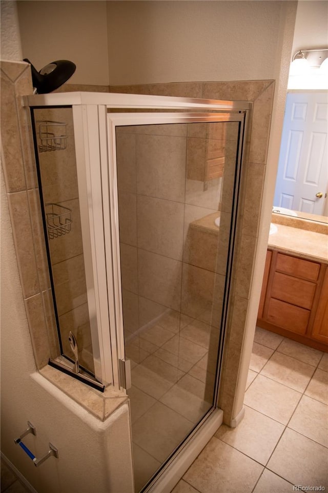 16180 E Geddes Ln Unit 14, Aurora, CO 80016 - full bathroom with a stall shower, tile patterned floors, and vanity