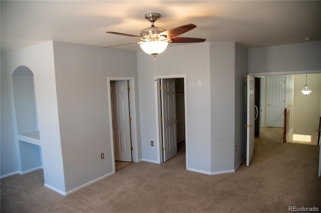 16180 E Geddes Ln Unit 14, Aurora, CO 80016 - unfurnished bedroom featuring carpet floors, a walk in closet, and a ceiling fan