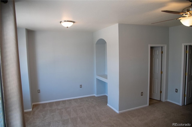16180 E Geddes Ln Unit 14, Aurora, CO 80016 - carpeted empty room featuring a ceiling fan and arched walkways