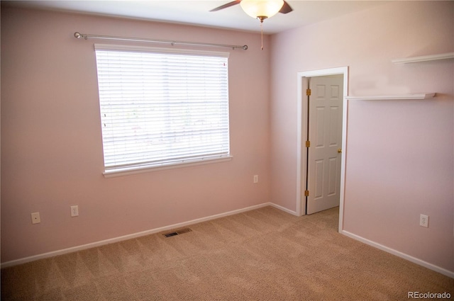 16180 E Geddes Ln Unit 14, Aurora, CO 80016 - unfurnished bedroom featuring multiple windows and light carpet