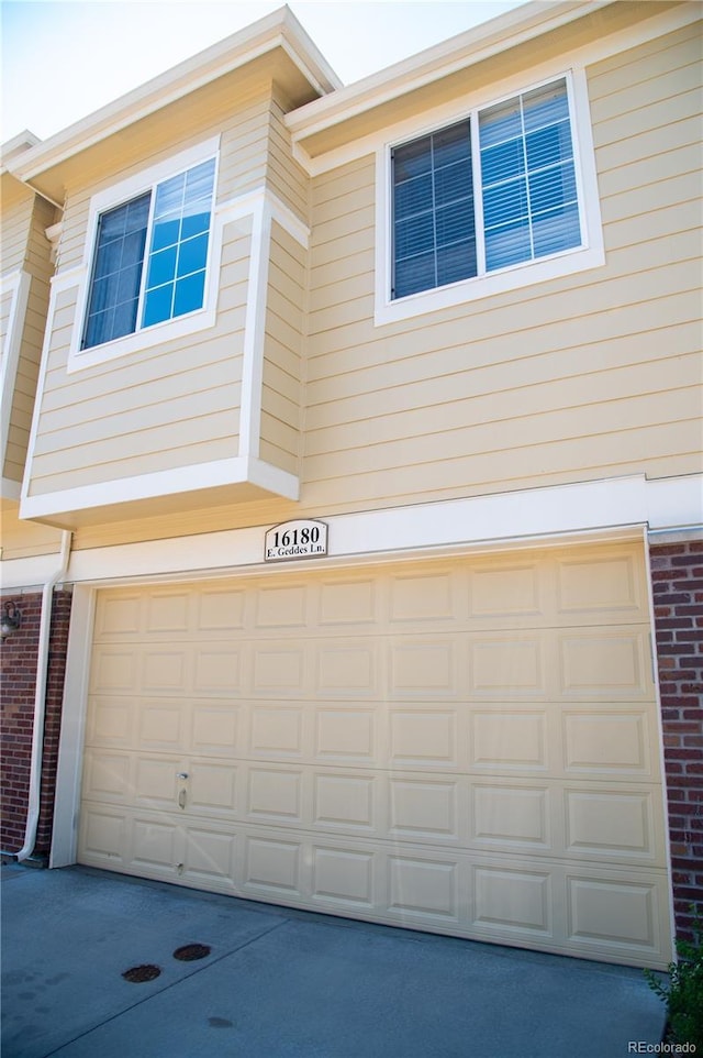 16180 E Geddes Ln Unit 14, Aurora, CO 80016 - garage featuring concrete driveway