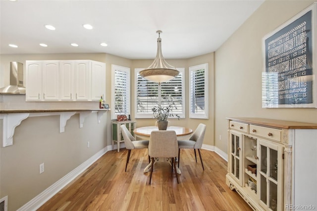 dining area featuring light wood-type flooring, visible vents, baseboards, and recessed lighting