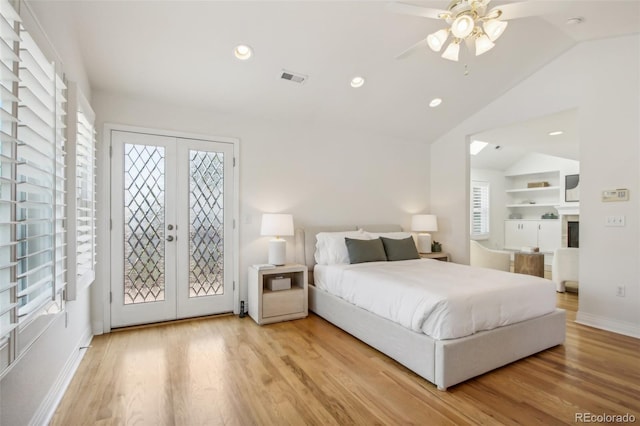 bedroom with lofted ceiling, french doors, visible vents, and access to exterior