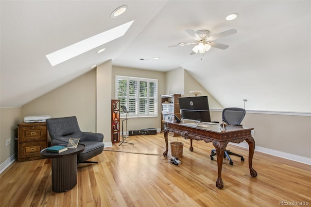 office space with vaulted ceiling with skylight, baseboards, wood finished floors, and recessed lighting