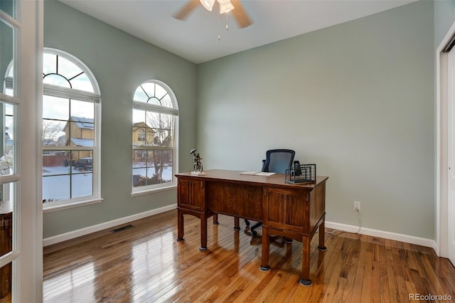 office area with light hardwood / wood-style floors and ceiling fan