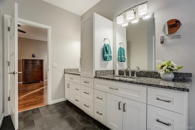 bathroom with wood-type flooring and vanity