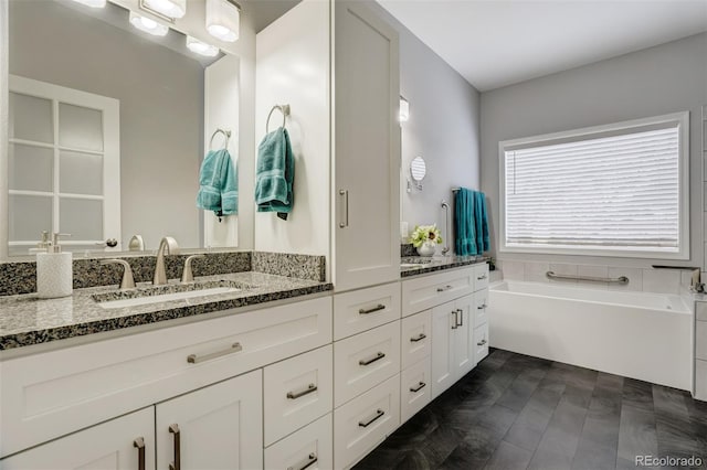 bathroom with a bath and vanity