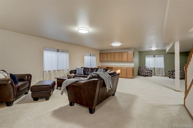 living room featuring light carpet