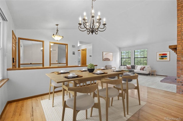 7888 S Poplar Way, Centennial, CO 80112 - dining space with lofted ceiling, light wood-style flooring, and a chandelier