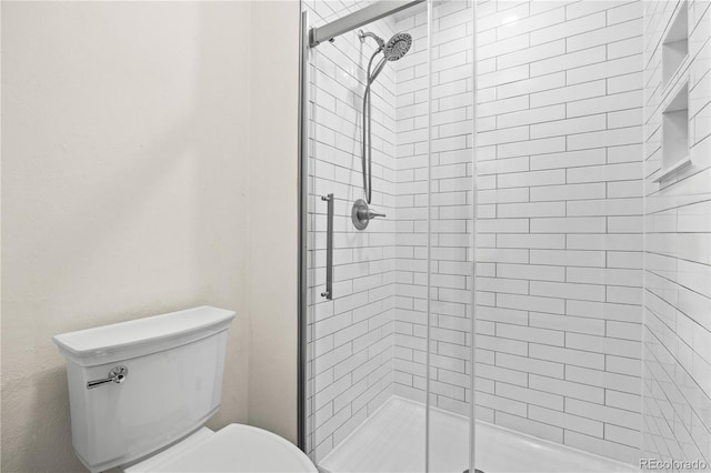 7888 S Poplar Way, Centennial, CO 80112 - full bathroom featuring a stall shower and toilet